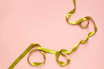 Fototapeta premium Golden ribbon on pink