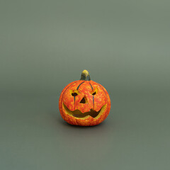 Halloween pumpkin on green background
