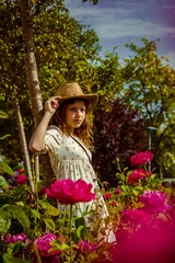 Foto op Canvas woman in a garden © frankalexander