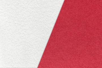 Fototapeta premium Texture of craft white and red paper background, half two colors, macro. Vintage dense kraft wine cardboard.