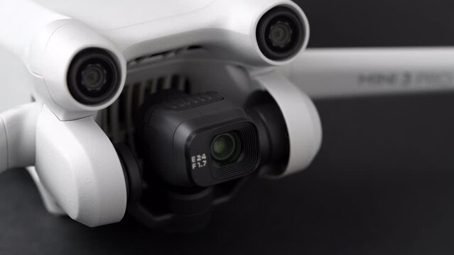 Mini 3 Pro drone of Dji brand with Vertical camera on dark background