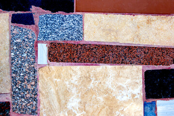 Wall, path, with tiled mosaics and granite pieces.