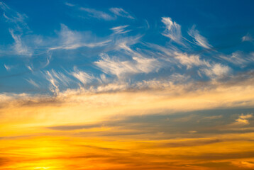 Beautiful yellow clouds in the blue sunset sky
