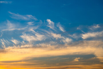 Beautiful yellow clouds in the blue sunset sky