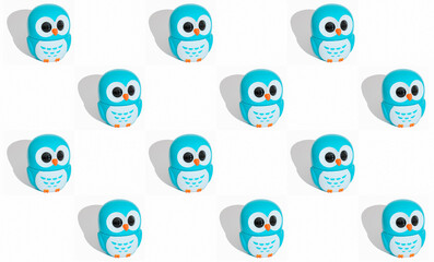 owl figurine pattern on white background. little blue owls isolated. Kids background, blogger or textile print