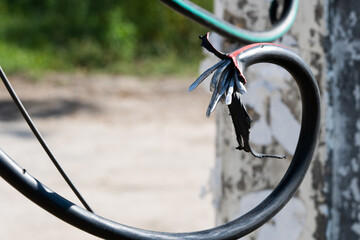 Broken black ground electric cord. Dangerous damage power electrical cable that can make electric...