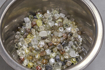 Beautiful rough diamonds in bowls.