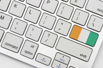 national flag of cote divoire on the keyboard on a grey background .3d illustration