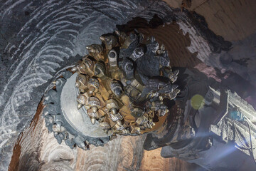 Roadheader machine in tunnel of kimberlite mine.