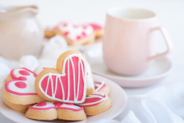 Close-Up of an Assortment of Heart Shaped Cookies on a Plate Set on a White Table  Horizontal