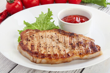 Grilled pork steak with ketchup