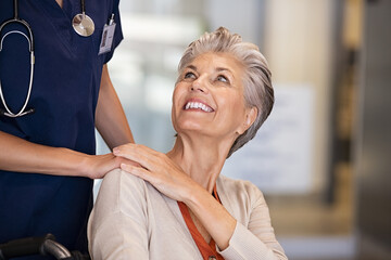 Caring nurse comforting old woman