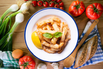 Traditional spanish tapa. Rabas, tasty fried squid with lemon.