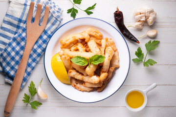 Traditional spanish tapa. Rabas, tasty fried squid with lemon.