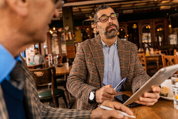 Talking about the documents on the tablet while thinking