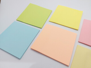 Fototapeta premium Small colorful notepad ( stiky notes ) on a white background