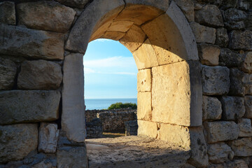 Fototapeta na wymiar Old stone window in Chersonesos with a view of the Black Sea