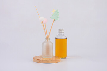 A bottle of perfume, A bottle of fragrant oil diffuser with Reed sticks, isolated on white background 