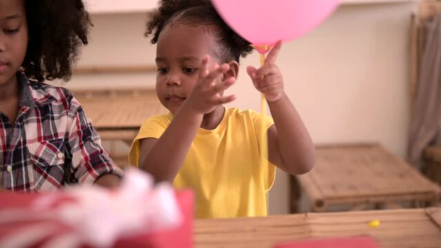Happy African American kids girl very happy with birthday party 