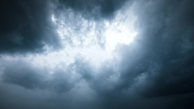 Typhoon day in summer. Fast moving dark clouds in blue sky. 4K sky clouds time lapse.