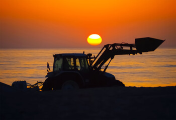 A tractor at sunset, symbolizing energy and the sun