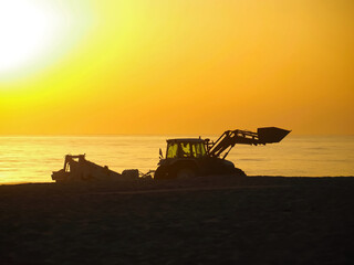 A tractor at sunset, symbolizing energy and the sun