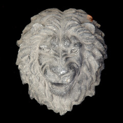 Beton lion head on the black background