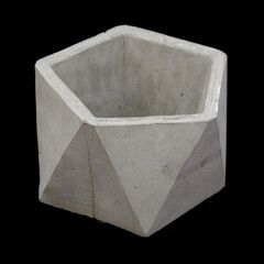 polygonal planter made of concrete on a black background