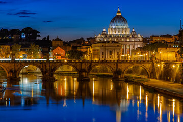 Fototapeta na wymiar Sunset view of Basilica Saint Peter, bridge Sant Angelo and river Tiber in Rome. Italy. Architecture and landmark of Rome. Postcard of Rome