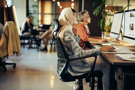 Muslim businesswoman working in a coworking office