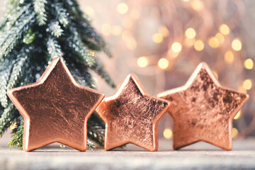 Christmas bronze decoration. Holiday decorations bronze on bokeh background.