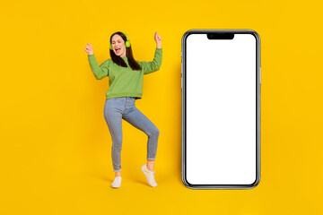 Fototapeta na wymiar Full length body size view of attractive woman rejoicing listening hit copy space ad isolated on vivid yellow color background
