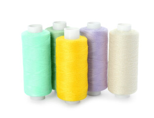 Set of different colorful sewing threads on white background