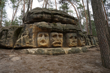 Fototapeta na wymiar Devils Heads (Certovy Hlavy) creepy rock sculptures, popular tourist attraction in Zelizy, Czechia
