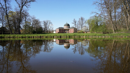 Fototapeta premium Veltrusy Mansion (Zamek Veltrusy), baroque chateau mirroring in pond, including large park, popular tourist landmark, Czechia