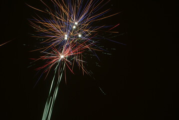 Firework explosion on New Year's Evening. Colorful fireworks in the night sky.