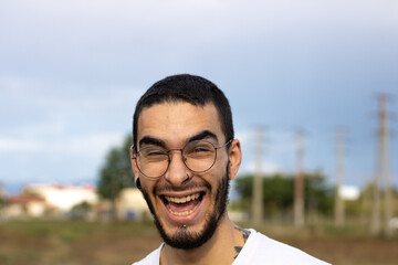 young man from front smiling crazy