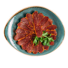 Plate of sliced dried beef tenderloin basturma