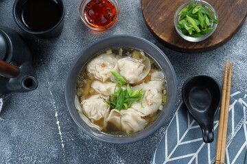 delicious of wonton soup with chili oil and green onion,chinese food,asian food style