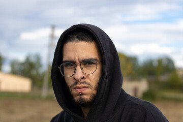 young man from front looking seriously