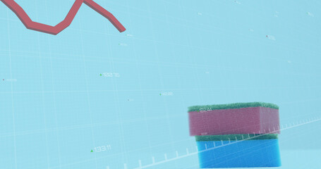 Image of financial data processing over kitchen sponges on blue background