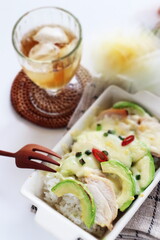 Baked cheese and avocado chicken gratin with iced tea