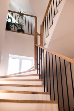 Wood Staircase Inside Contemporary White Modern House.