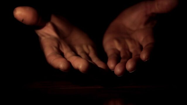 man praying to god with hands together Caribbean man praying with black background stock footage
