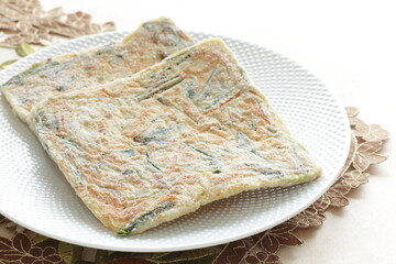 Korean frozen food, leek jeon on white plate