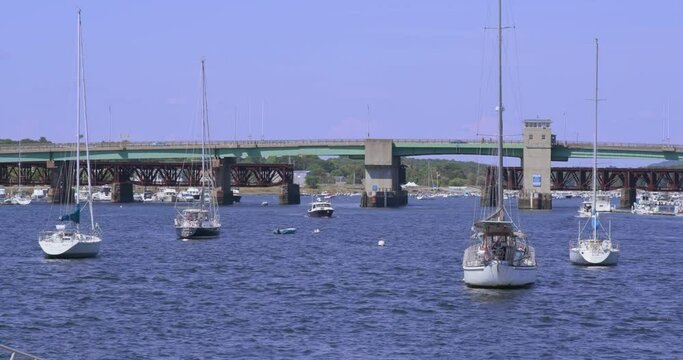 Boats moored and idling  in Newburyport harbor marina