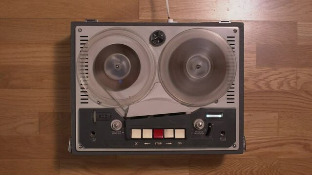 Top view of a old tape recorder playing and rewinding