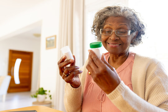 Happy Senior African American Women Taking Her Medications