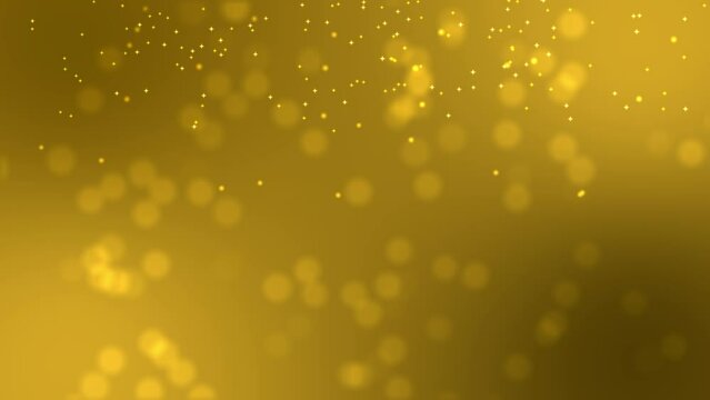 Blurred gold background with lots of shiny particles coming down the screen. Beautiful and luxurious animated background. Particles of light and gold across the screen