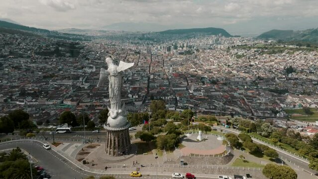 Drone Orbiting On Virgin Of El Panecillo Overviewing Cityscape Of Quito, Ecuador. Aerial Shot